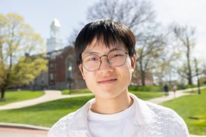 Andy Zhang '26 (CLAS) poses for a photo near Wilbur Cross on Tuesday, April 29, 2025