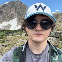 Headshot of Alejandro hiking