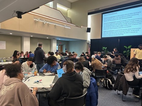 Trumbull High School students working collaboratively with Dr. Smirnova’s students during ECON 1202 Principles of Macroeconomics class on March 26, 2026.
